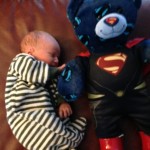 Ryan and Mylanies New Baby Boy Logan Walter Barre Cochrane with his new superman teddy bear